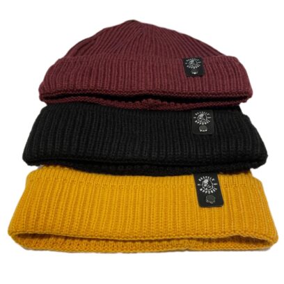 Akepele 11" Ribbed Beanie with faux leather patch and steel rivet. Group